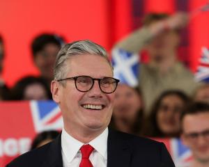 Keir Starmer, leader of Britain's Labour party, reacts as he addresses his supporters at a...