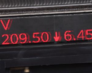 Stocks showing losses are displayed at the entrance to the New York Stock Exchange in New York...