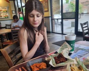 Meila Davis, 12, at fast-food chain Wing Stop, while in North Carolina for treatment earlier this...