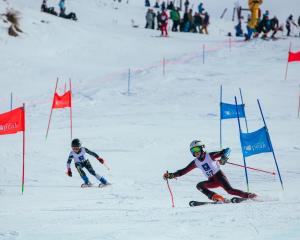 Young skiers Nero Saunders (left, 12) and Damien Ricard (12) compete in the National Junior...