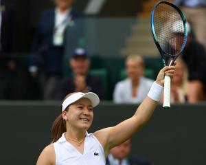 New Zealand's Lulu Sun celebrates winning her first round Wimbledon match against China's Qinwen...