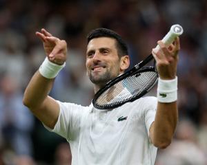Seven-time champion Novak Djokovic, of Serbia, celebrates after his fourth-round Wimbledon...