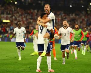 England's Harry Kane celebrates with Ollie Watkins after winning the match. Photo: Reuters 