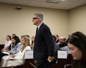 Alec Baldwin enters court during his involuntary manslaughter trial in New Mexico. Photo: Pool...