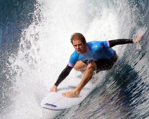 Billy Stairmand, of New Zealand, in action during his surfing heat in Teahupo'o, Tahiti, French...