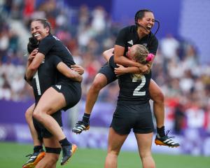 The Black Ferns celebrate their tight win over Canada in the Olympic final in Paris. Photo: Reuters 