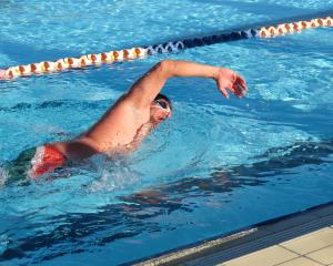Duncan Kukard, of Auckland, swims in water just 2°C above freezing in Alexandra’s outdoor pool...