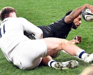 All Black wing Sevu Reece dots down for the first try of the test against England at Forsyth Barr...