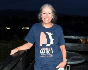 American expat Amy Witter, wearing her "Women’s March" T-shirt, says she is worried about the...