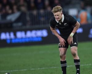 All Blacks first five Damian McKenzie prepares for a late penalty attempt, but is about to get...