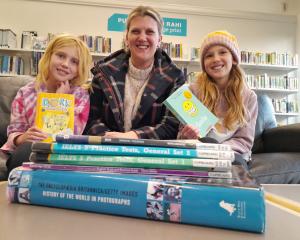 English as Second Language teacher Jo Hewson-Williams, centre, with her daughters Lola (8, right)...