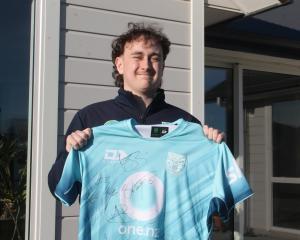 Invercargill teenager Jessie Sanford proudly shows the jersey he was given by New Zealand...