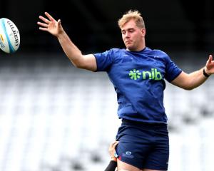 Blues lock Sam Darry leaps for a lineout takes during a training session. PHOTOS: GETTY IMAGES 