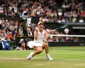 Lulu Sun celebrates after her win over Emma Raducanu on Wimbledon's Centre Court. Photo: Getty...