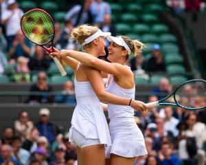New Zealander Erin Routliffe (left) and Canadian Gabriela Dabrowski celebrate after winning their...