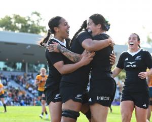Katelyn Vahaakolo of the Black Ferns celebrates with team mates after scoring a try during the...