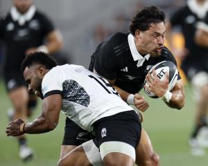All Black Billy Proctor collides with Fiji’s Vilimoni Botitu during the one-off test at...