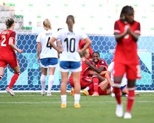 Canada's Cloe Lacasse celebrates scoring her team's first goal during the match against New...