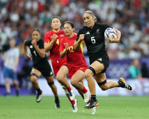 Sarah Hirini breaks away to score New Zealand's first try during their quarterfinal against China...