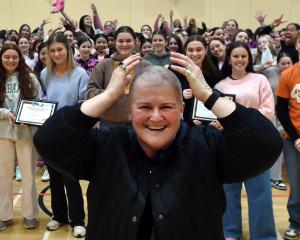 Queen’s High School deputy principal Stephanie Ashton after she received a hair cut at assembly...