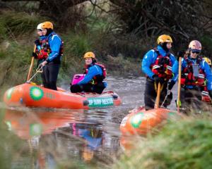 Police search the Halswell River in Greenpark after Yanfei Bao's disappearance. Photo: RNZ / Nate...