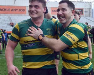 Green Island players Heath MacEwan,left and Daniel Smart celebrate their win in the Dunedin...