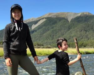 A younger Lulu Sun, pictured with her younger brother, Quintin, having fun in the wilderness of...