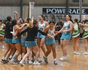 Auckland players celebrate their extra-time victory to win the national under-18 title at the...