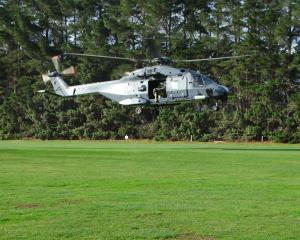 An NH90 helicopter lands on the back fields at Waitaki Boys’ High School earlier this week. PHOTO...