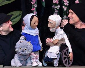 Birdlife productions puppeteers Bridget and Roger Sanders hold their puppets Aya and Mohammed in...