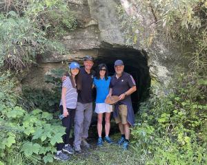 Pictured at the entrance to the "Hugo Tunnel", part of a new section of the Queenstown Trail are,...