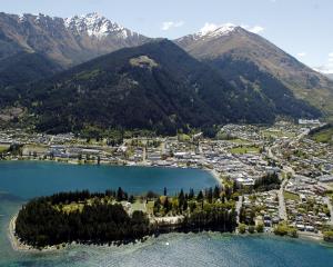 The Queenstown township looking towards Arthurs Pt. Queenstown Bay and the CBD are in the...
