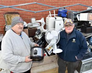 Dunedin South Lions Club members Brian Grounds (left) and Keith Harris with some of the...