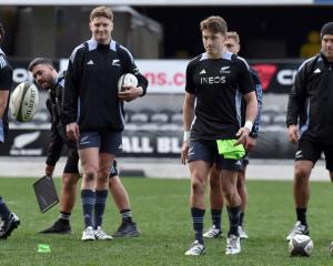 Beauden Barrett (right) and younger brother Jordie compete in a kicking game at the end of the...