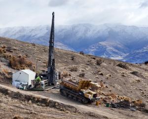 A drilling rig at the Rise and Shine deposit, atop the Rise and Shine ridge, as part of the...