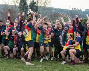 Clutha Valley players and supporters celebrate victory over West Taieri in the Southern Region...