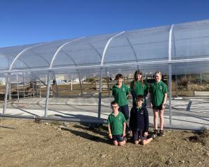 Posing outside a tunnel house being built at their school are Poolburn School pupils (clockwise...