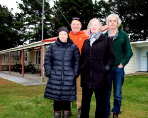Keeping the community informed are Aramoana Civil Defence Committee members (from left) Vicki...