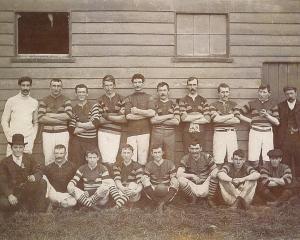 Members of the West Taieri Rugby Club gather outside the old West Taieri Football Pavilion about...