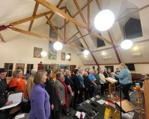 Members of Dunedin Star Singers rehearse under the baton of conductor Rosemary Tarbotton ahead of...