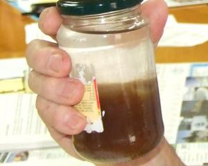 A sample of Tapanui water. PHOTO: ODT FILES