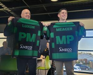 New Zealand Prime Minister Christopher Luxon (left) and Rangitata MP James Meager show off their...