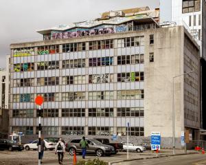 The quake damaged building on Hereford St attracted squatters and graffiti for more than a decade...