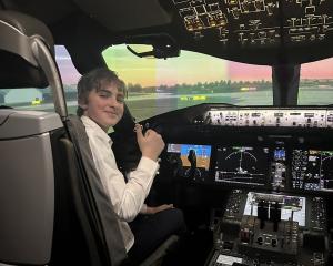 Benjamin Paterson on the flight deck of a Boeing 787 Dreamliner at Air New Zealand’s flight...