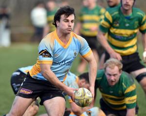University halfback Bradley Campbell ignites the attack against Green Island at Miller Park on...