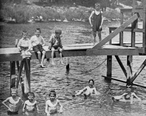 Children play in Lake Wakatipu, Queenstown, early in 1924. — Otago Witness, 25.3.1924
