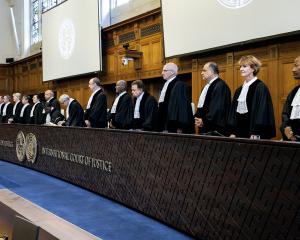 Judges rise before delivering a non-binding ruling on the legal consequences of the Israeli...