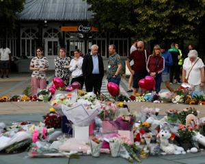 Floral tributes are laid in Southport following a vigil for the victims of the knife attack....