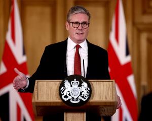 Britain's Prime Minister Keir Starmer delivers a speech in London following clashes after the...