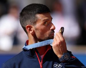 Novak Djokovic celebrates after winning Olympic gold in Paris. Photo: Reuters